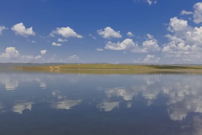 Framed Print : Fluffy clouds in a blue summer sky, reflected in a lake, distant reflected gers, Arkhangai Framed Print : Fluffy clouds in a blue summer sky, reflected in a lake, distant reflected gers, Arkhangai