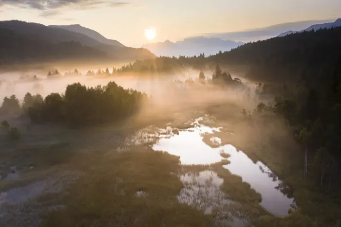Framed Print : Fog at sunrise over the swamp of Pian di Gembro Nature Reserve, aerial view, Aprica Framed Print : Fog at sunrise over the swamp of Pian di Gembro Nature Reserve, aerial view, Aprica