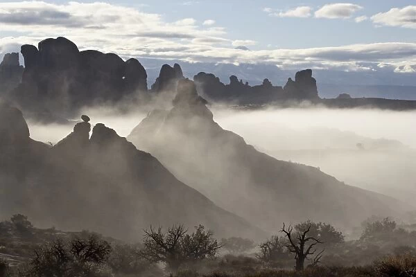 Fog surrounding formations, Arches National Park, Utah, United States of America