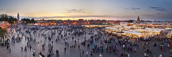 Food stalls, people and Koutoubia Mosque at sunset, Place Djemaa el Fna, Marrakech, Morocco, North Africa, Africa