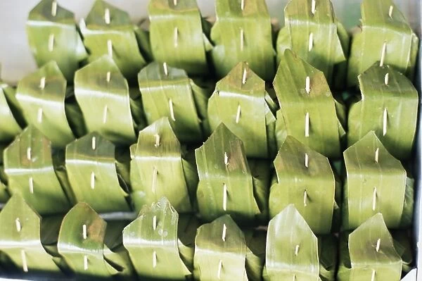Food wrapped in banana leaf at open air market