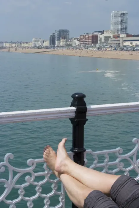 Framed Print : Foot sunbathing on the pier, Brighton, Sussex, England, United Kingdom, Europe Framed Print : Foot sunbathing on the pier, Brighton, Sussex, England, United Kingdom, Europe