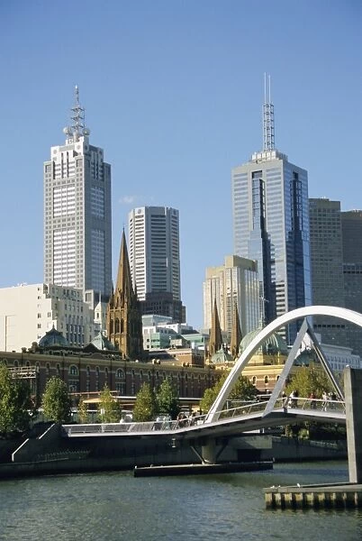 Footbridge over the River Yarra and city skyline, Melbourne, Victoria, Australia