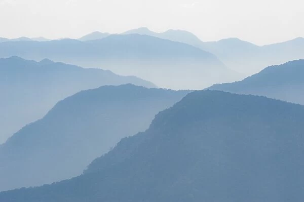 Foothills of the Himalayas in east Bhutan take on an ethereal appearance in early morning mist