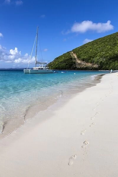 Footprints in white sand on shoreline with yacht, White Bay, Jost Van Dyke, British Virgin Islands, West Indies, Caribbean, Central America