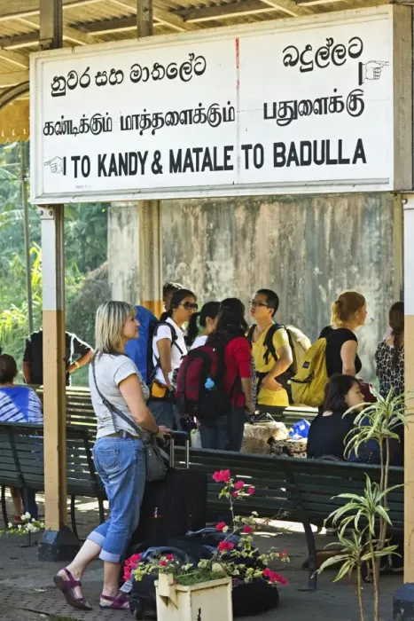 Framed Print : Foreign travellers await the popular Colombo to Badulla train at the railway station at Peradeniya Framed Print : Foreign travellers await the popular Colombo to Badulla train at the railway station at Peradeniya