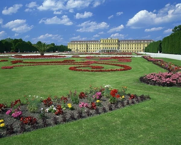 Formal gardens with flower beds in front of the Schonbrunn Palace, UNESCO World Heritage Site
