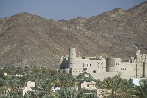 Fort in palmery on edge of modern oasis town, Bahla, Oman, Middle East