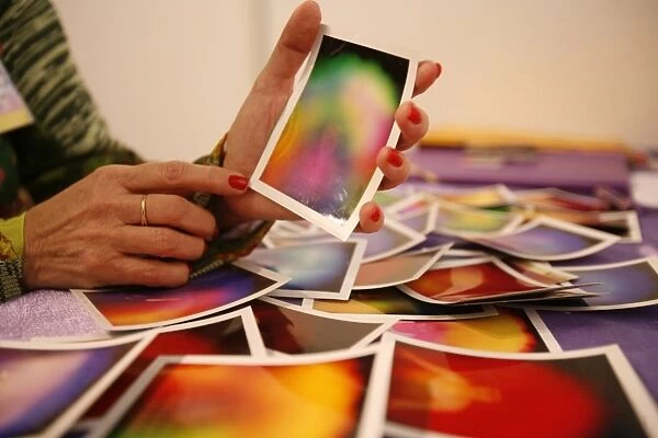 Fortuneteller showing a picture of an aura, Paris, France, Europe