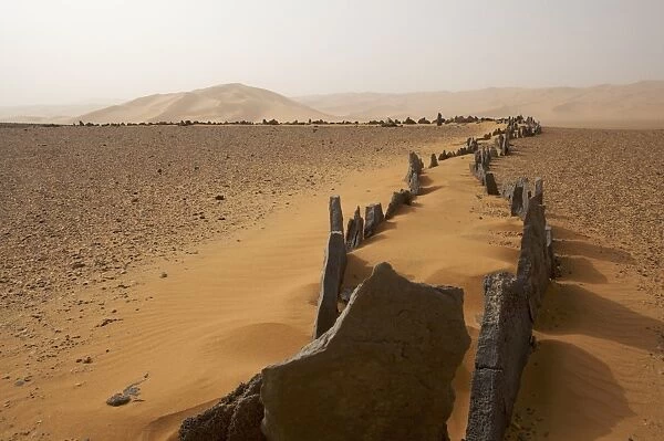 Foundations of an ancient temple on the reg Taita in the Akakus plateau in the Fezzan Desert