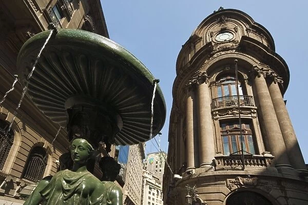 Fountain outside the Bolsa de Comercio (Stock Exchange), founded 1893, on Bandera in the commercial heart of the capital city, Santiago, Chile