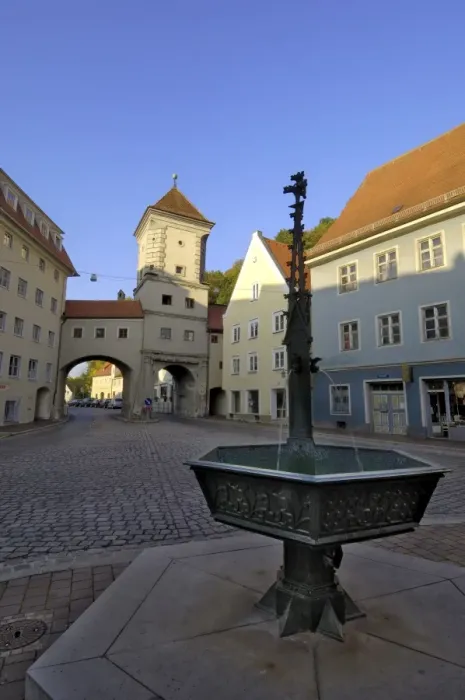 Framed Print : Fountain and the Sandauertor (Sandau Gateway) in the city walls
