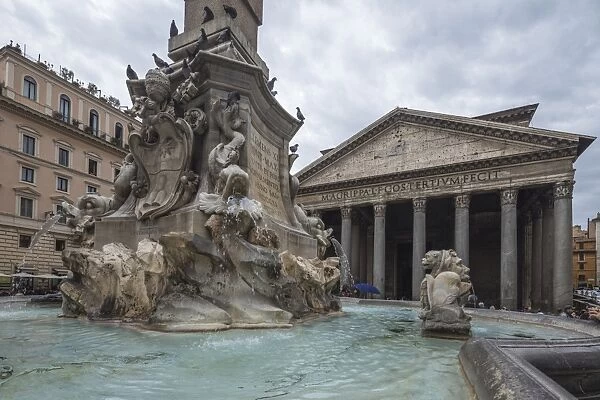 The fountain with statues frames the ancient temple of Pantheon, UNESCO World Heritage Site