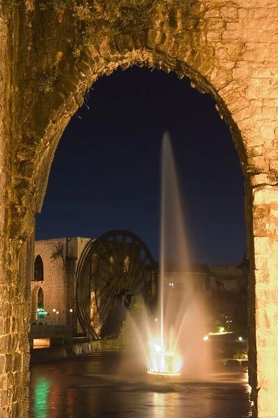 Fountain and water wheel on the Orontes River at night