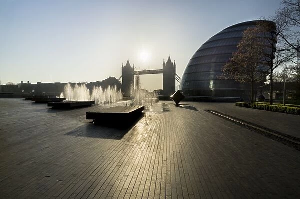 Fountains glisten at More Place with City Hall and Tower Bridge behind, London, England, United Kingdom, Europe