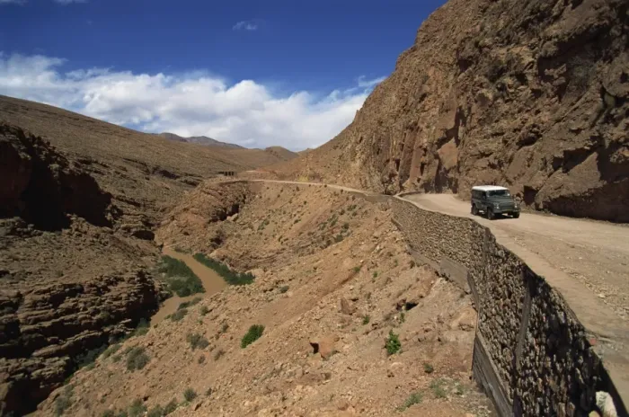 Framed Print : Four-wheel drive vehicle on a road through the Atlas Mountains Framed Print : Four-wheel drive vehicle on a road through the Atlas Mountains