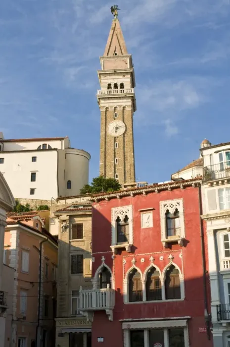 Framed Print : Free standing bell tower of Cathedral of St. Georges between houses, Piran Framed Print : Free standing bell tower of Cathedral of St. Georges between houses, Piran