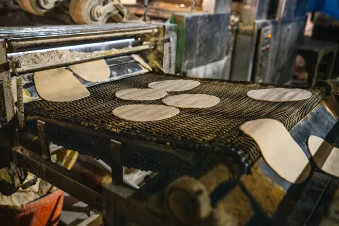 Framed Print : Fresh Roti being made on a conveyor belt at the Golden Temple, Amritsar, Punjab, India, Asia Framed Print : Fresh Roti being made on a conveyor belt at the Golden Temple, Amritsar, Punjab, India, Asia