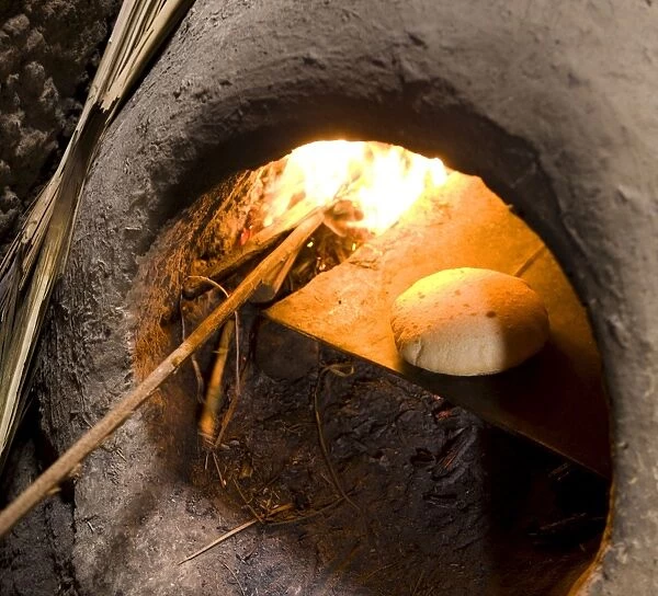 Freshly-baked bread in a traditional communal clay oven in the town of Merzouga