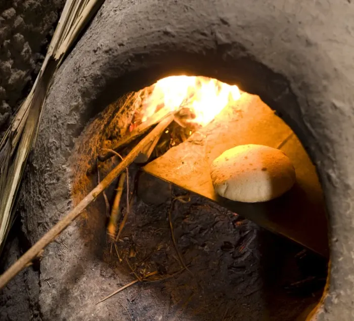 Framed Print : Freshly-baked bread in a traditional communal clay oven in the town of Merzouga Framed Print : Freshly-baked bread in a traditional communal clay oven in the town of Merzouga