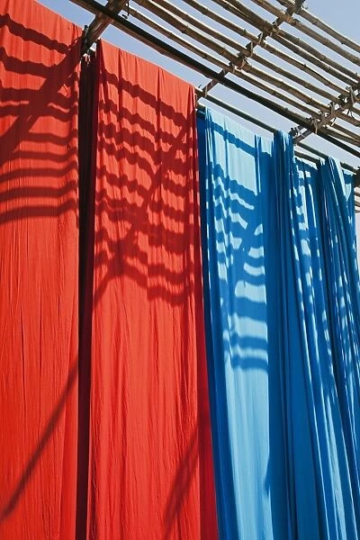 Freshly dyed fabric hanging to dry, Sari garment factory, Rajasthan, India, Asia