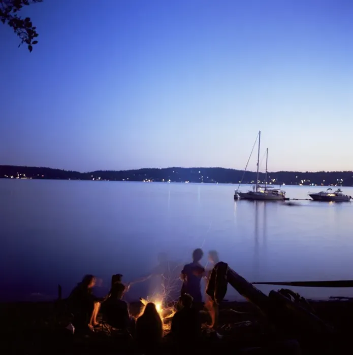 Framed Print : Friends around beach fire