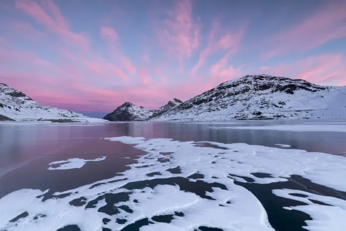 Framed Print : The frozen Lago Bianco framed by pink clouds at dawn, Bernina Pass, canton of Graubunden Framed Print : The frozen Lago Bianco framed by pink clouds at dawn, Bernina Pass, canton of Graubunden