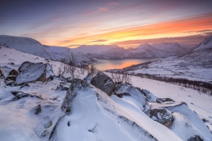 Framed Print : Frozen sea surrounded by snow framed by the orange sky at sunset, Torsken, Senja Framed Print : Frozen sea surrounded by snow framed by the orange sky at sunset, Torsken, Senja