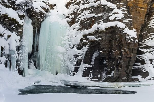 A frozen waterfall in Abisko National Park, Sweden, Scandinavia, Europe