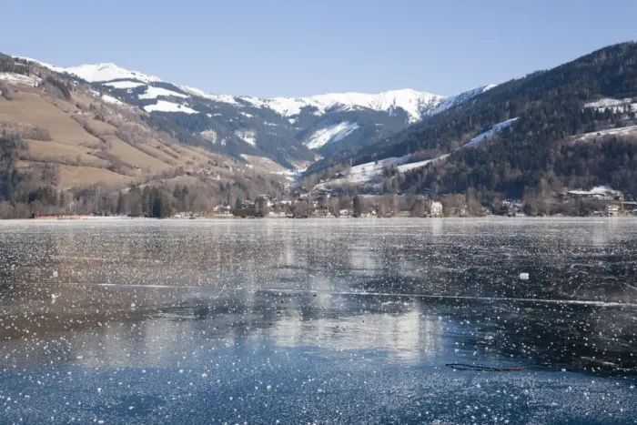 Framed Print : Frozen Zeller See lake with snow capped mountains reflected in ice in alpine resort Framed Print : Frozen Zeller See lake with snow capped mountains reflected in ice in alpine resort