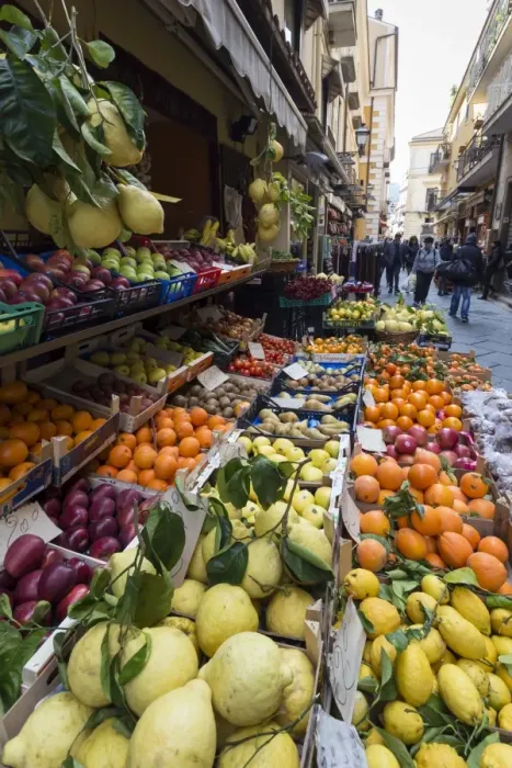Framed Print : Fruit, including local lemons and oranges, displayed outside a shop in a narrow street Framed Print : Fruit, including local lemons and oranges, displayed outside a shop in a narrow street