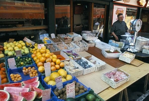 Fruit stall and vendor at Nachtsmarkt, Mariahilf, Vienna, Austria, Europe