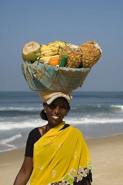 Fruit vendor on beach near the Leela Hotel