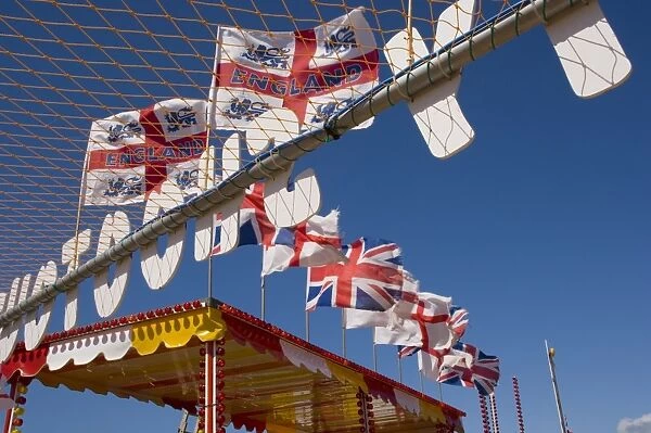 Funfair flags on beach, Selsey Bill, Sussex, England, United Kingdom, Europe