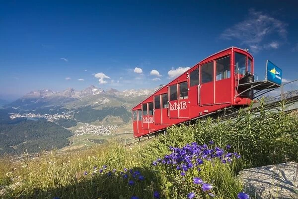 The funicular railway runs across the alpine meadows, Muottas Muragl, Samedan, Canton of Graubunden