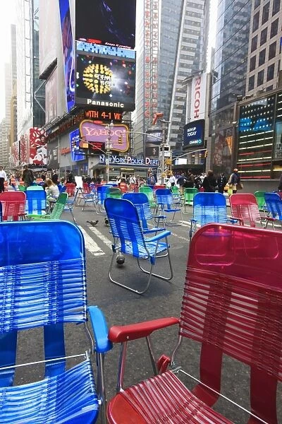 Garden chairs in the road for the public to sit in the pedestrian zone of Times Square
