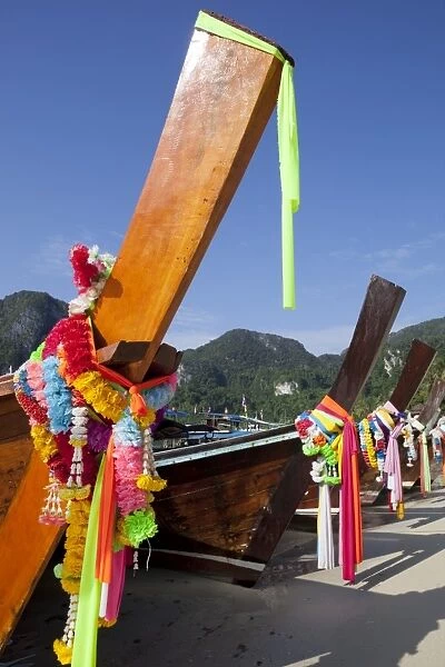 Garlands decorating long-tail boats, Koh Phi Phi, Krabi Province, Thailand, Southeast Asia, Asia