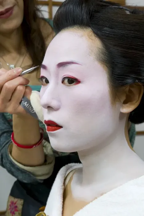 Framed Print : Geisha having her make-up applied Framed Print : Geisha having her make-up applied