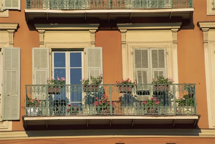 Framed Print : Detail of geraniums on a wrought iron balcony on an ochre coloured house in the Old Town of Nice Framed Print : Detail of geraniums on a wrought iron balcony on an ochre coloured house in the Old Town of Nice