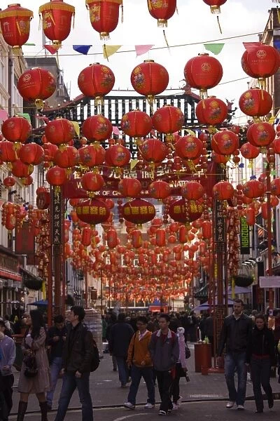 Gerrard Street, Chinatown, during Chinese New Year celebrations colourful lanterns decorate the surrounding streets, Soho, London, England, United