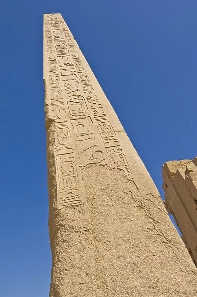 Giant granite obelisk decorated with hieroglyphics at the great Temple at Karnak near Luxor
