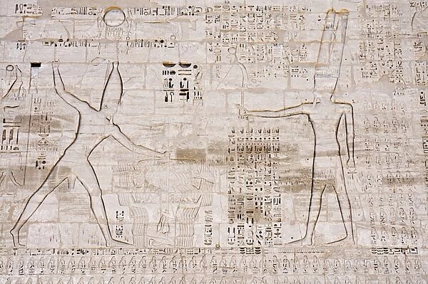 Giant relief of Rameses III smiting enemies before Amen-Ra, South Tower of the first Pylon
