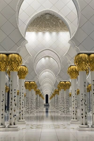 Gilded columns leading to the main prayer hall of Sheikh Zayed Bin Sultan Al Nahyan Mosque