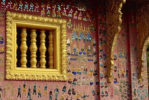 Gilded wooden window and decorated wall of the Wat