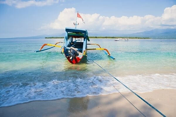 Gili Meno, a traditional Indonesian boat on Gili Meno with Gili Air and Lombok in the background, Gili Islands, Indonesia, Southeast Asia, Asia
