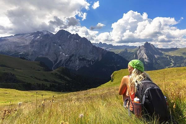 Girl looks Marmolada from Viel del Pan path. Pordoi Pass, Fassa Valley, Trentino