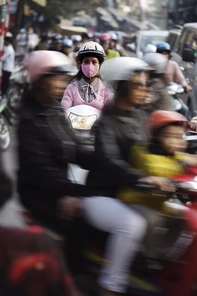 Girl on scooter Hanoi, Vietnam, Indochina, Southeast Asia, Asia