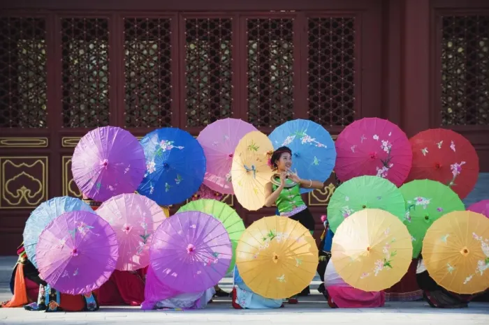 Framed Print : Girls dancing with colourful parasols at the Ethnic Minorities Park, Beijing, China, Asia Framed Print : Girls dancing with colourful parasols at the Ethnic Minorities Park, Beijing, China, Asia