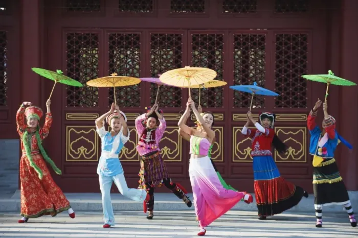 Framed Print : Girls dancing with coourful parasols at the Ethnic Minorities Park, Beijing, China, Asia