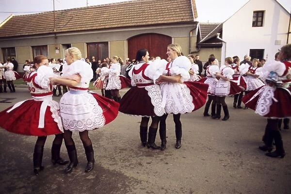 Girls dancing in traditional dress, Dress Feast with Wreath and Duck Festival